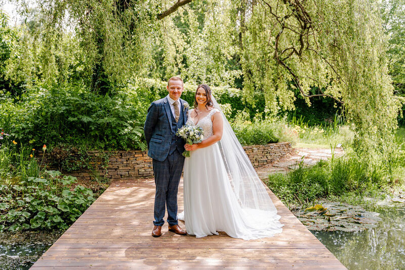 Valleyside Barn - small_WeddingVenuesDevonValleysideBarnValleyside-Barn_Couple-by-pond_Hannah-Frost-Photography.jpg